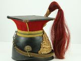 an image of a hat with a long red hair on a white surface