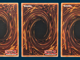 three cards with a picture of a black hole in the middle of them