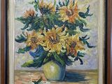 painting of sunflowers in a green vase on a table