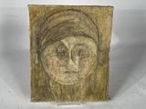 painting of a woman ' s face on a piece of wood