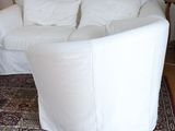 an image of a living room with a couch and a rug