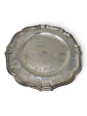 an antique silver plate on a white background with a white background