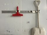 a shovel and a shovel hanging on a wall