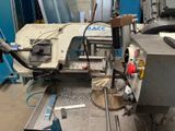 a machine that is working on a piece of metal