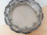 a silver plate that is sitting on a table