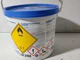 a bucket with a sign on it sitting on a table