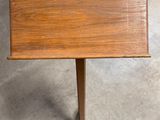 a small table with a wooden top on a metal stand