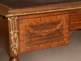 a wooden desk with a drawer on top of it