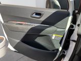 a car door with the door handle open and the door handle down