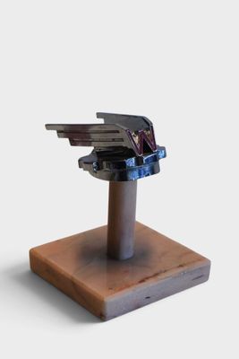 a wooden stand with a bunch of keys on top of it