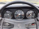 a steering wheel and gauges in the dashboard of a car
