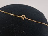 a black hat with a gold chain around it