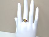 a hand with a ring on it that is on a mannequin