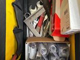 a box full of tools sitting on top of a table