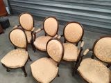 several chairs are lined up in a circle on a concrete floor