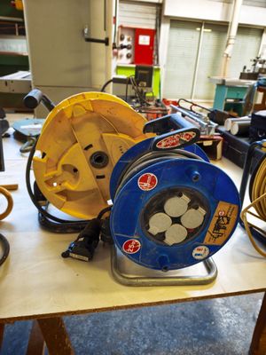 many different types of hoses sitting on a table