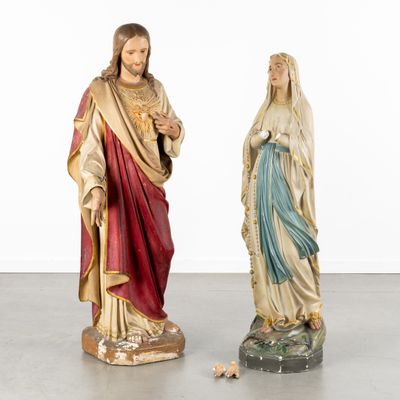 two statues of jesus and mary are standing next to each other