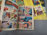 a person holding a comic book open on a table