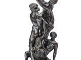 an image of a bronze statue of three men and a dog