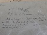 a piece of paper with writing on it sitting on a table