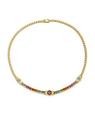 un collier en or orné de pierres multicolores montées sur une chaîne
