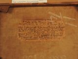 a piece of paper with writing on it on a shelf