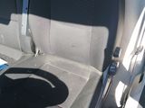 a seat in the back of a car with a dog on it