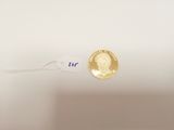 a gold coin with a picture of a man on it