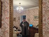 a woman taking a picture of herself in a mirror