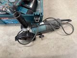 an image of a corded drill and a box of tools
