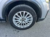 a close up of a car ' s tire on the road