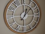 a large clock with roman numerals on the face