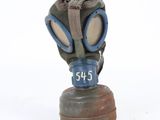 a gas mask on a wooden base on a white surface