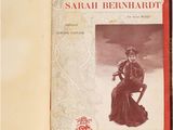 a book with a picture of a woman in a dress