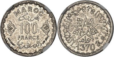 a silver coin with a star on the front and a star on the back