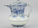 blue and white porcelain teapot with a dragon handle