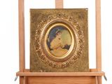 a picture of a woman on a easel with a picture on it