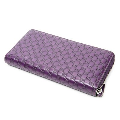 purple leather wallet with a zipper closure and a zippered closure