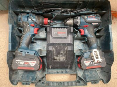 two power tools in a case on the floor