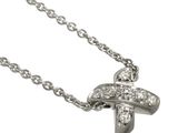 an image of a diamond cross pendant on a silver chain