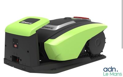 a close up of a green and black machine on a white background
