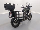 a black and white motorcycle parked in a white room