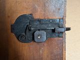 a close up of a latch on a wooden door