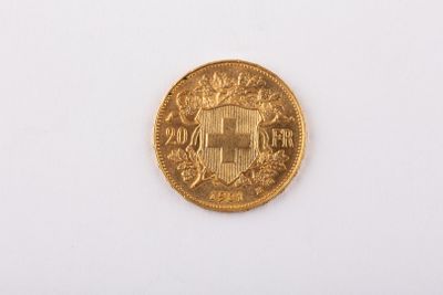 une image d'une pièce d'or sur une surface blanche
