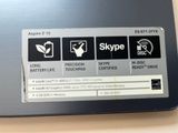 a close up of a laptop with a skype logo on it