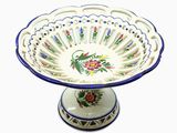 a blue and white bowl with a flower design on it