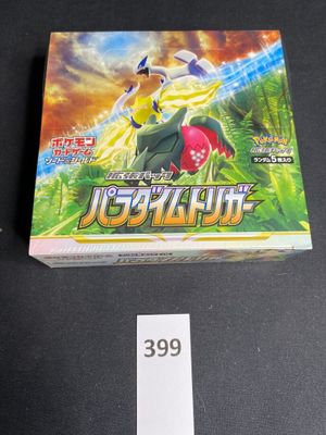 a close up of a box of pokemon trading cards on a table
