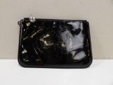 black leather purse with a gold design on the front of it