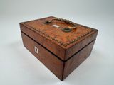 an image of a wooden box with a handle on it