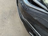 a close up of a car ' s headlight and front bumper
